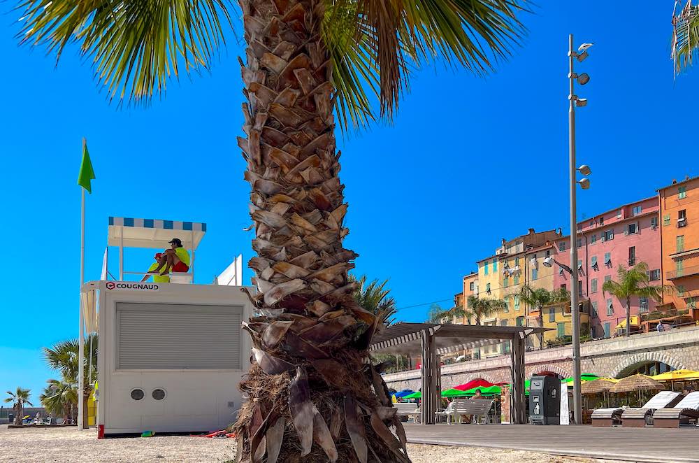 Sablettes Beach Menton lifeguard tower with the Old Town behind it