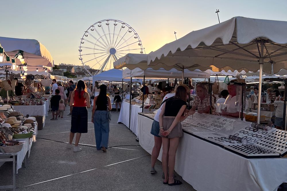 End your summer day in Antibes France with a visit to the artisan market at Esplanade du Pre des Pecheurs