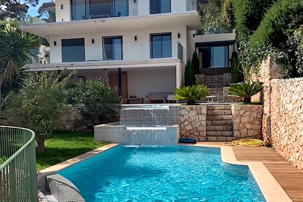 Modern villa with a waterfall pool