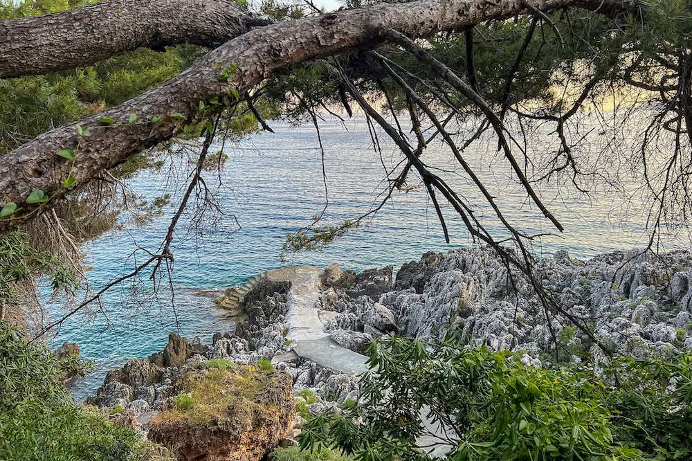 Stone stairs leading to a swimming spot along the Cap Martin coastal path