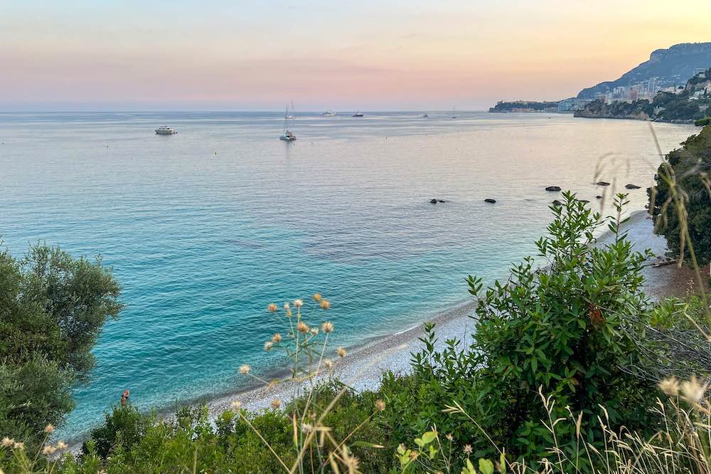 Sunset over Plage du Buse with Monaco in the backdrop