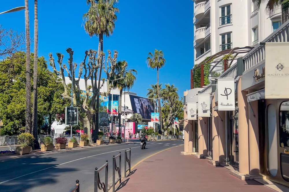 Luxury boutiques and the Palais des Festivals on the Boulevard de la Croisette in Cannes