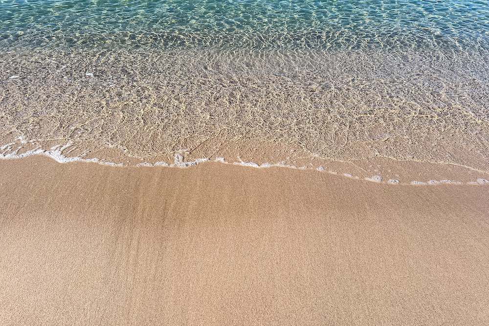 Soft sand and clear water on the beach in Cannes