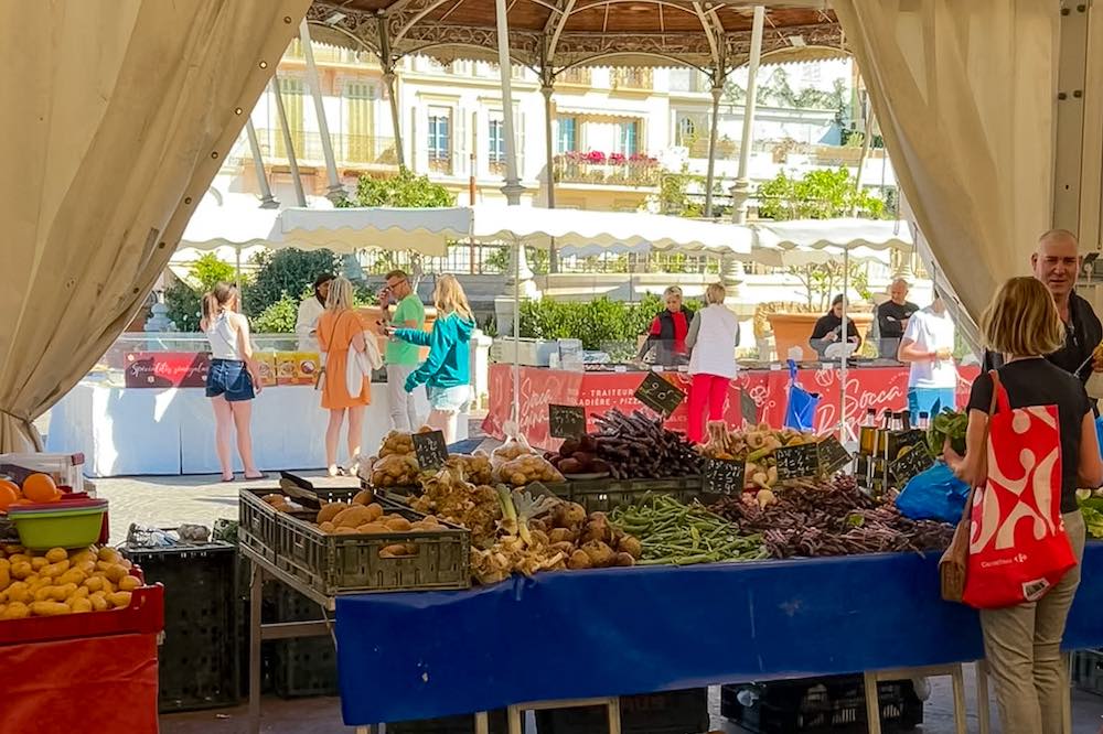 Fresh produce vendors at Marché Forville in Cannes