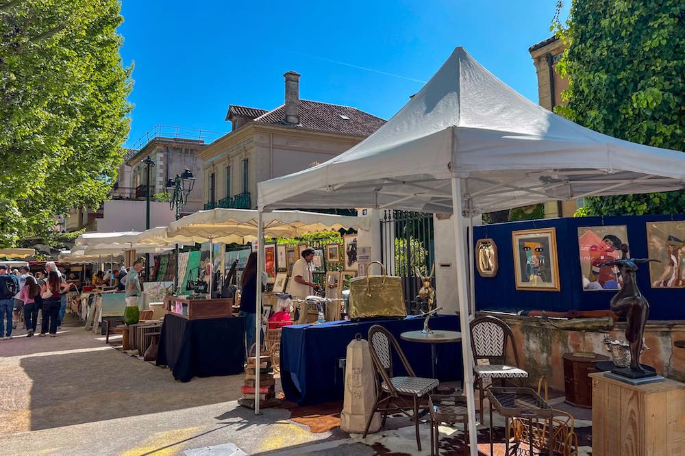 Shoppers browsing stalls at Place des Lices Market in Saint-Tropez