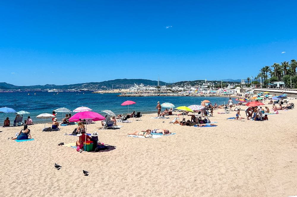 Families enjoying the gentle slope at Bijou Plage, a public beach in Cannes